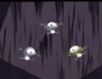 a group of cartoon characters are standing next to each other in a dark room .