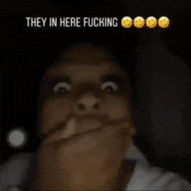 a blurry picture of a person 's hand with the words " they in here fucking "