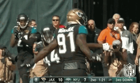 a football player wearing a jersey with the number 91