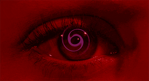 a close up of a person 's eye with a purple swirl in the middle