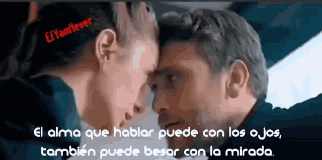 a man and a woman are looking at each other with a caption in spanish