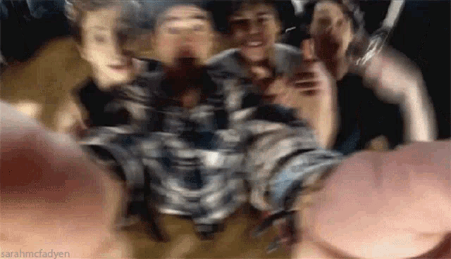 a blurry picture of a group of people with the name sarahmcfadyen visible