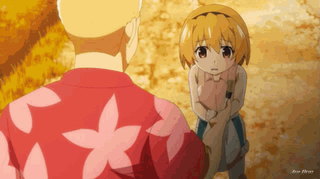 a man and a girl are standing next to each other and the girl is wearing a flowered shirt