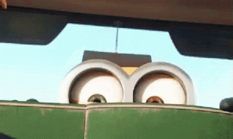 a close up of a cartoon character 's eyes on a green couch