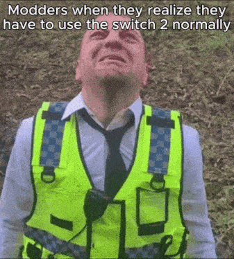 a man in a yellow vest and tie is crying with the caption modders when they realize they have to use the switch normally
