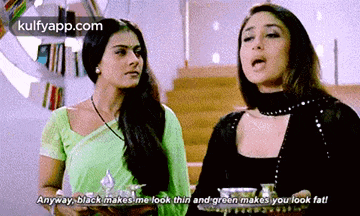 two women are standing next to each other and one of them is saying anyway black makes me look thin and green makes you look fat !