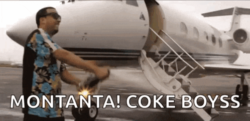 a man standing in front of a plane with the words montanta coke boyss written on the bottom