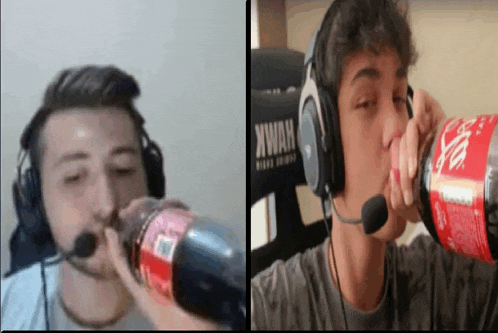 a man wearing headphones drinking a bottle of coke