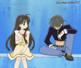 a girl in a yellow dress sits next to a boy in a black shirt with the name kissmeshinge501 on the bottom