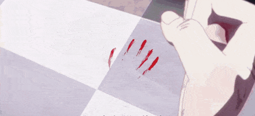 a close up of a person 's hand with blood on it