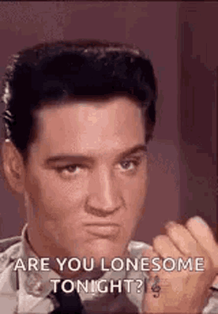elvis presley is making a face and saying `` are you lonesome tonight '' .