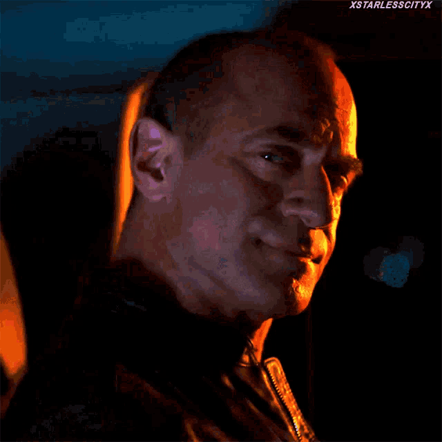 a close up of a man 's face with xstarlesscityx written on the bottom