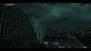 an aerial view of a city at night with a sign that says hd ory 1