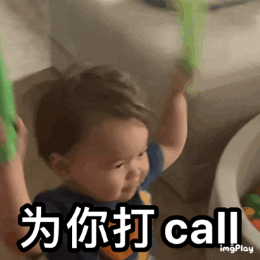 a baby in a blue shirt is holding a green stick and says call