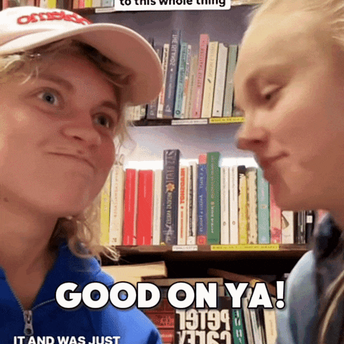 a woman says good on ya in front of a book shelf full of books