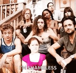 a group of people are sitting on a set of stairs and one of them is saying `` i 'm shameless ''