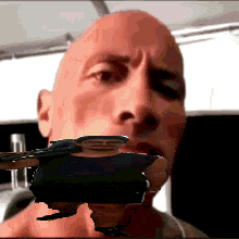 a close up of a man 's face with a picture of a man 's face on it