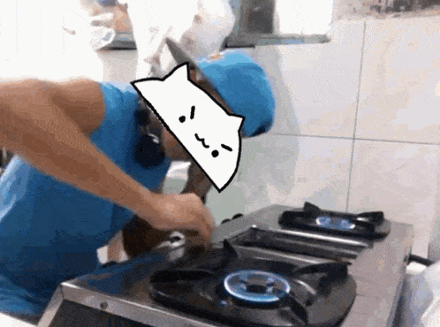 a man in a blue shirt is cooking on a stove top