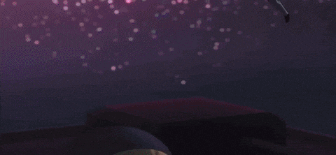 a person is touching a woman 's face with a purple light coming out of her eyes .