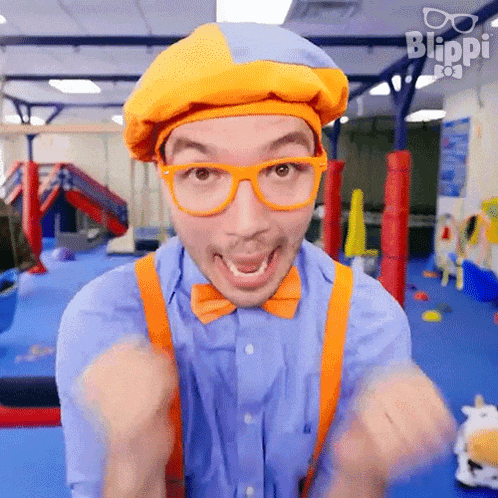 a man in a clown costume is making a funny face while wearing glasses and suspenders .