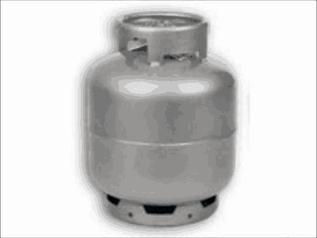 a stainless steel gas cylinder is sitting on a white surface .