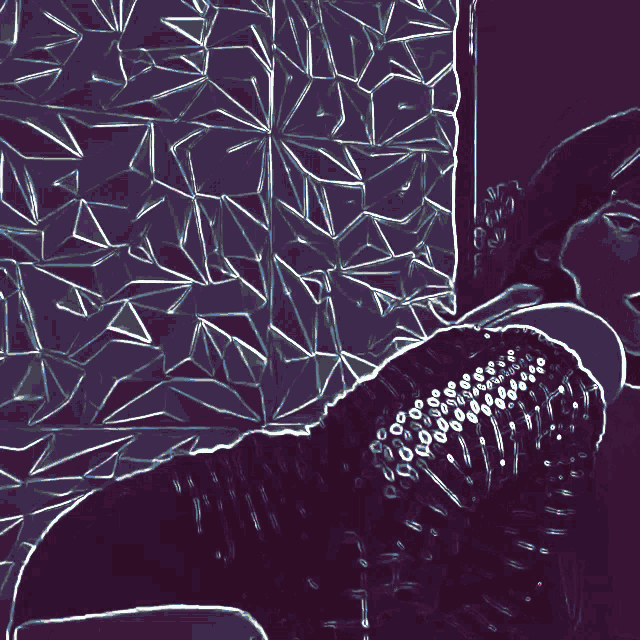 a woman is laying on a bed with her legs crossed and a green background