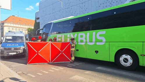a green and white bus with the word bus on the side