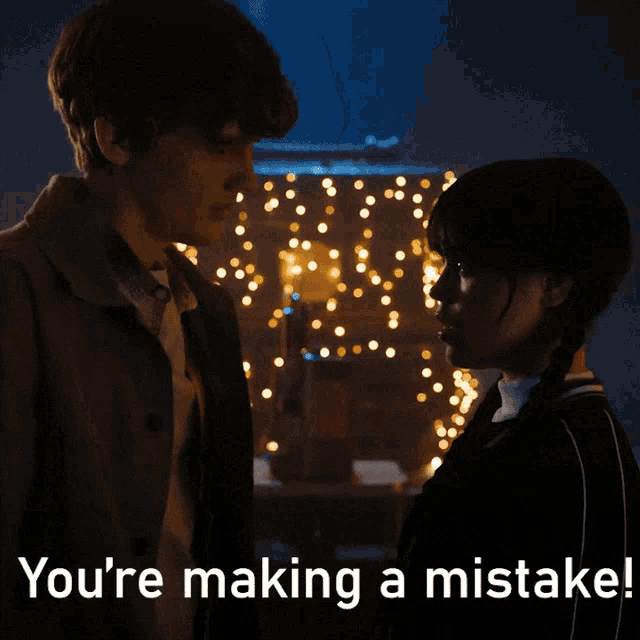 a man and a woman are looking at each other with the words " you 're making a mistake " above them