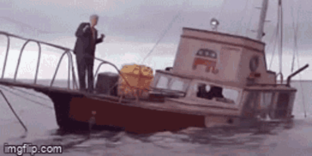 a man is standing on the deck of a boat that has the letters ff on it