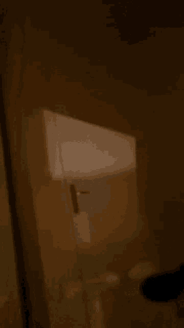 a man in a black shirt is standing in a doorway