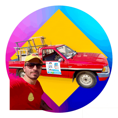 a man stands in front of a red truck that says bluegrass express