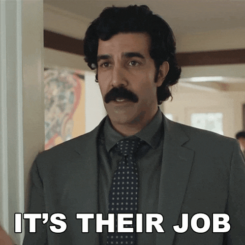 a man in a suit and tie with the words it 's their job