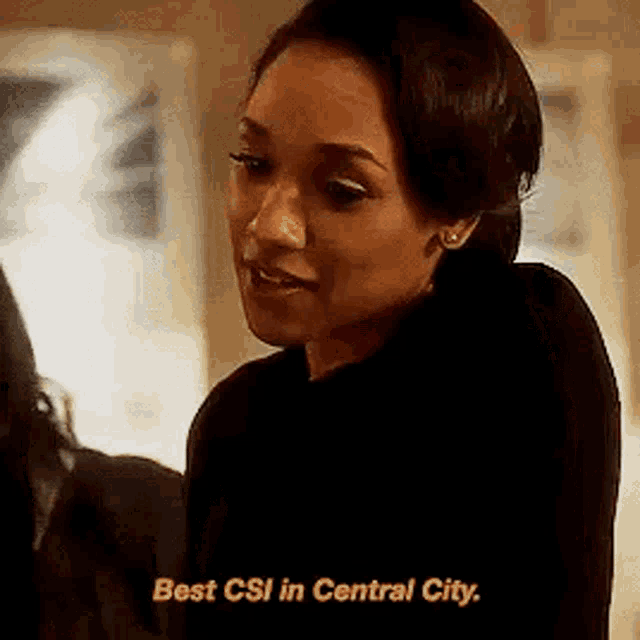 a woman is talking to another woman in a room and says `` best csi in central city . ''