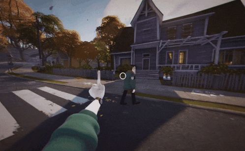 a person giving a middle finger in front of a purple house