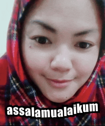 a woman wearing a red scarf with the words assalamualaikum on the bottom