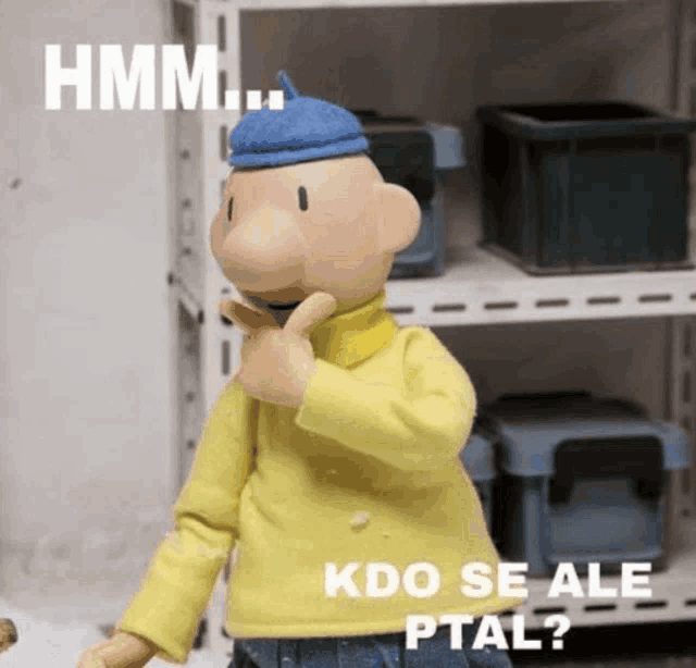 a cartoon character is standing in front of a shelf and says hmm kdo se ale ptal ?