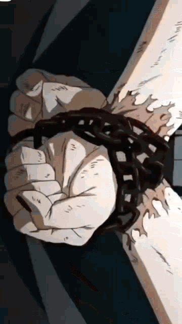 a person 's hand is chained to a pole