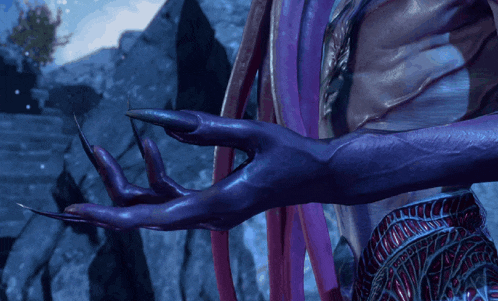 a close up of a person 's purple hand with long nails