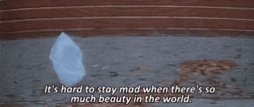 a cloud is painted on a brick wall with the words it 's hard to stay mad