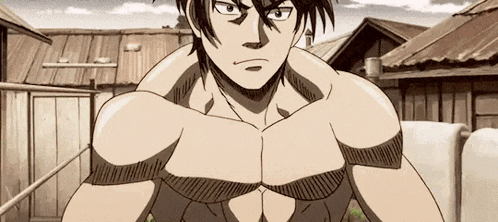 a man without a shirt is standing in front of a row of houses .