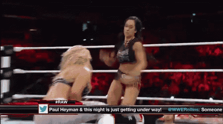 two women are wrestling in a ring with the words paul heyman & this night is just getting underway