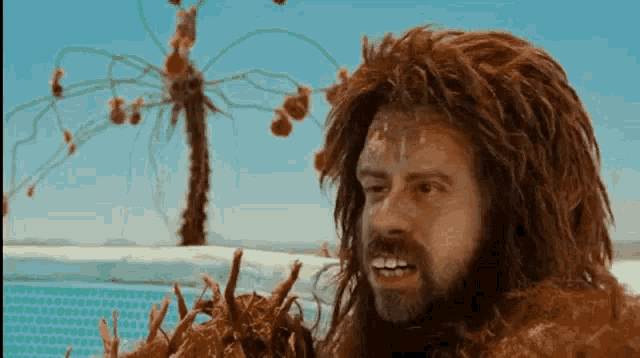a man with a beard and a wig is standing in front of a pool