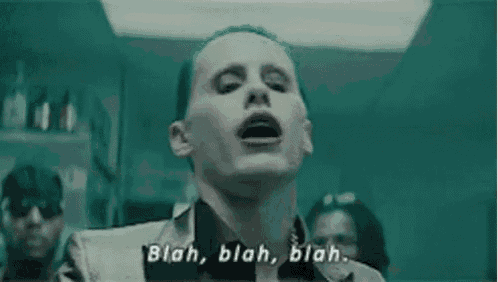 the joker from the movie suicide squad is making a funny face and saying `` blah blah blah . ''