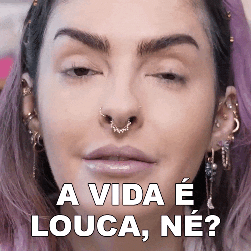 a close up of a woman 's face with the words " a vida e louca ne " above her