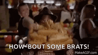 a man in a hat is holding a stack of hot dogs and says `` how bout some brats '' .