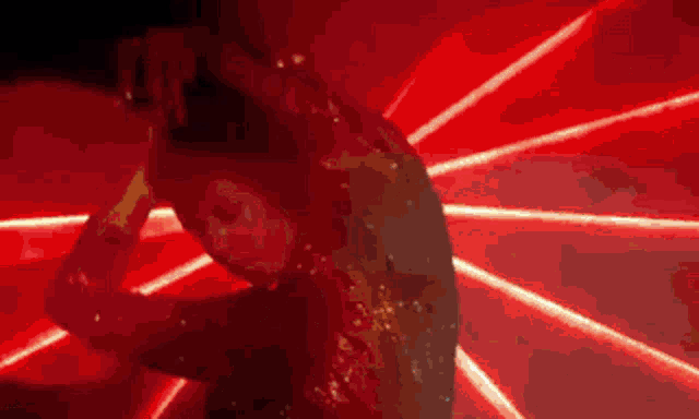 a pixelated image of a woman 's face with a red light behind her