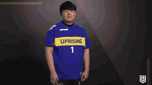 a man wearing a blue uprising jersey with the number 1 on it