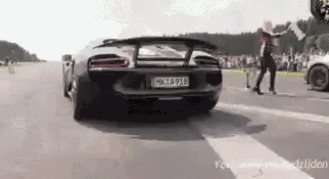 a car with a license plate that says mcta916 is driving down a road
