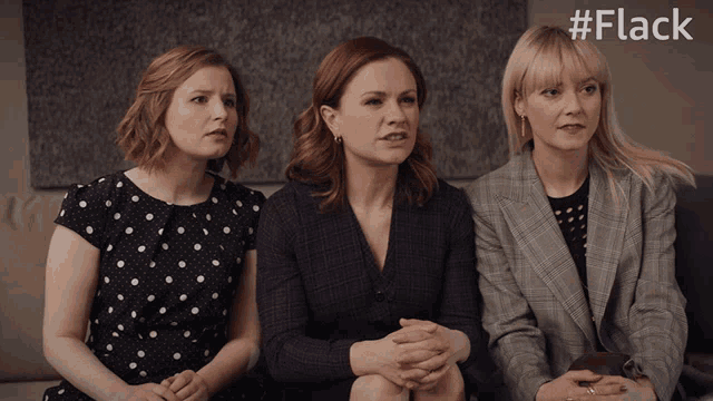 three women are sitting on a couch with the hashtag #flack on the bottom