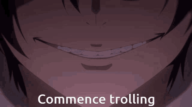 a close up of a person 's face with the words " commence trolling " on the bottom